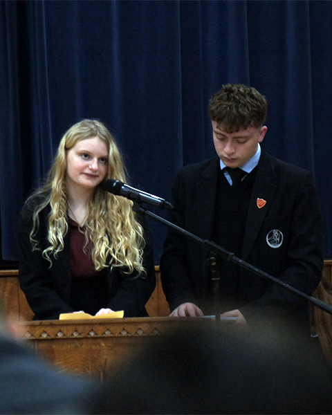 Wesley and Georgia, Year 13 and our Sixth Form 'courageous advocates' leading the prayers of intercession.